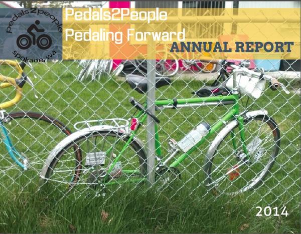 Pedals2People "Pedaling forward" Annual Report 2014. Photo shows bicycle parked in a yard.