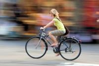 Woman riding a bicycle.