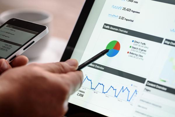 Person pointing a stylus at a screen that has local seo analytics on it Person pointing a stylus at a screen that has local seo analytics on it
