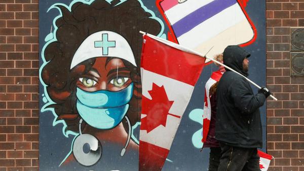 A mural in Ottawa, where protests against mask-wearing are creating havoc LARS HAGBERG
