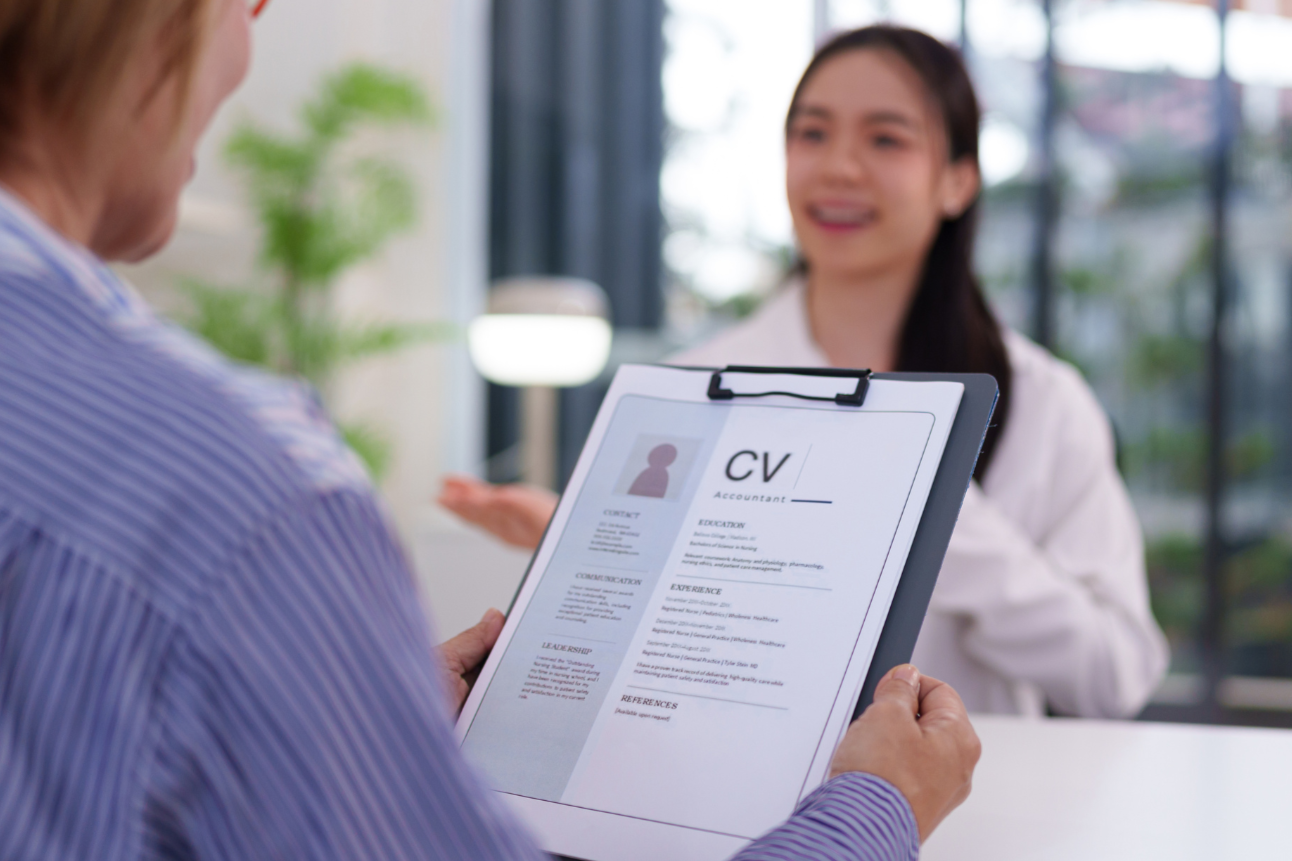 Hiring manager reviewing ATS-optimized resume in Toronto office