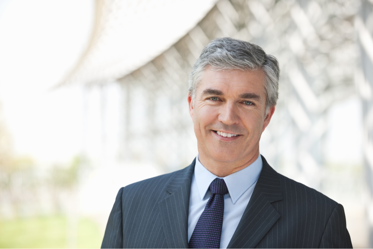 Seasoned corporate professional in a blue suit Seasoned corporate professional in a blue suit