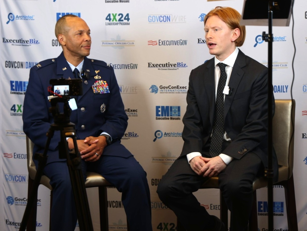Charles Lyons-Burt and Marqus Randall. The journalist interviews the Space Operations Command colonel and director of intelligence at a conference. Charles Lyons-Burt and Marqus Randall. The journalist interviews the Space Operations Command colonel and director of intelligence at a conference.