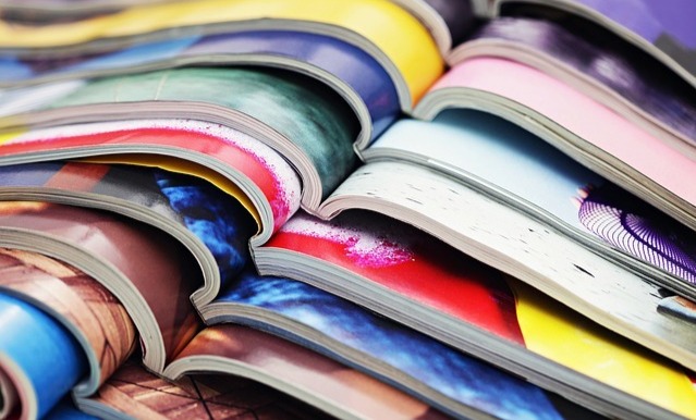 Photograph of a stack of brightly coloured magazines Photograph of a stack of brightly coloured magazines