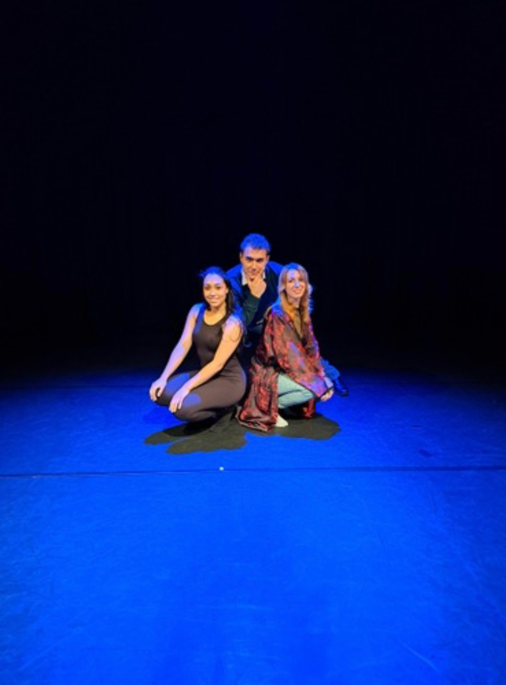 Theatrical performance still from One Day Fly showing actors on stage in costume.