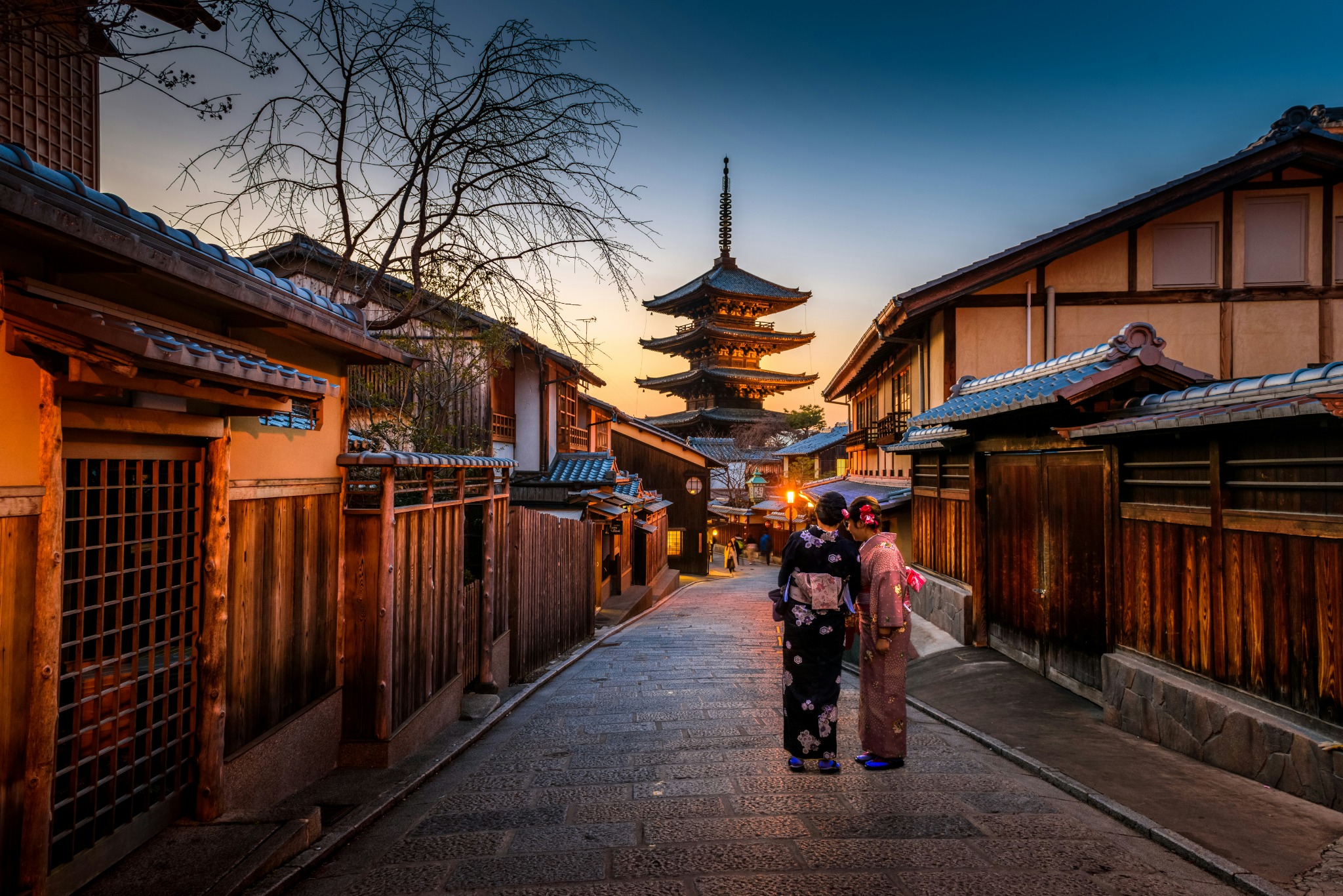 An image showing two women walking on the streets of Gion in Kyoto.