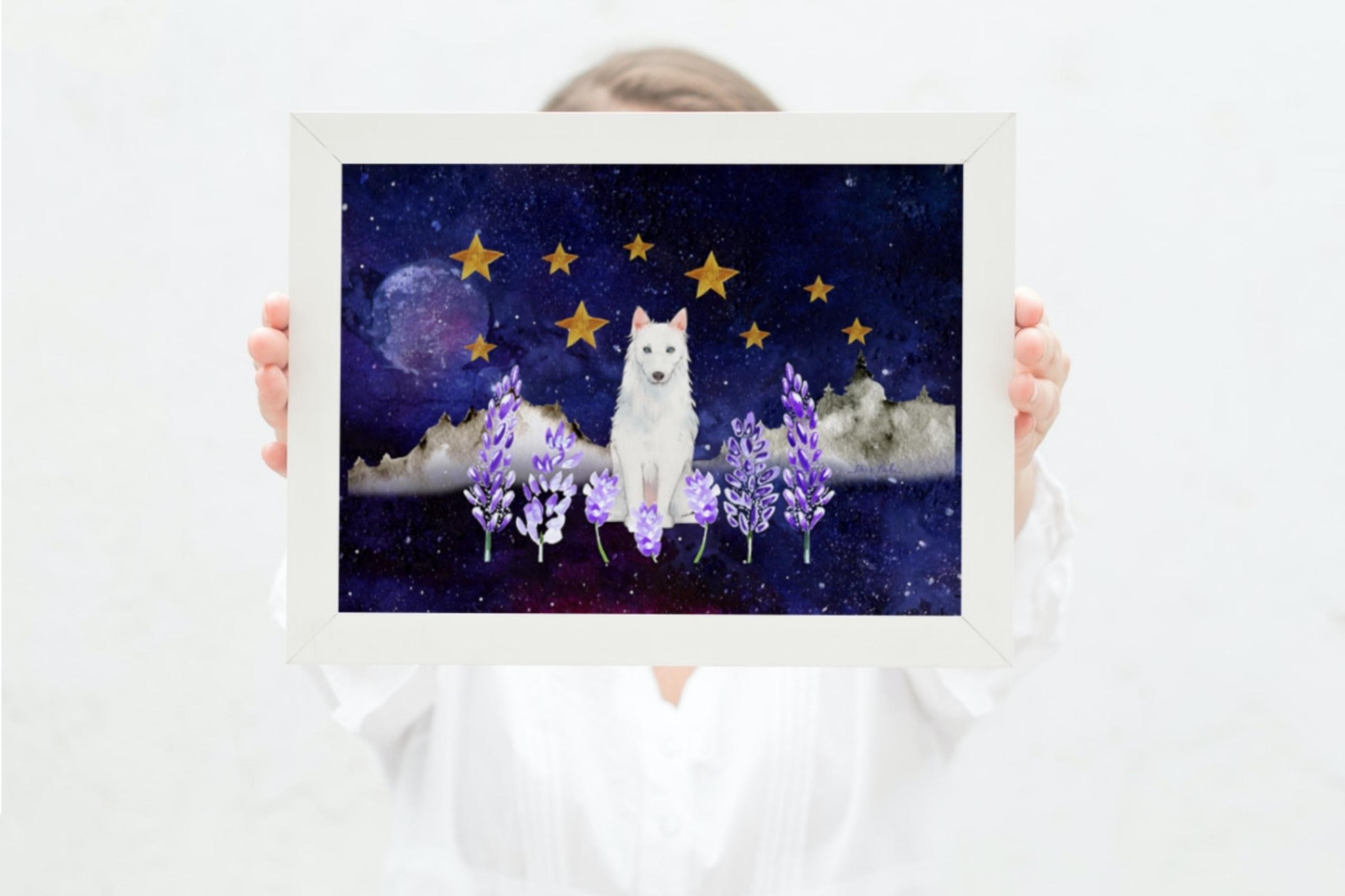 woman holding  blue sky picture with stars and moon an white woolf
