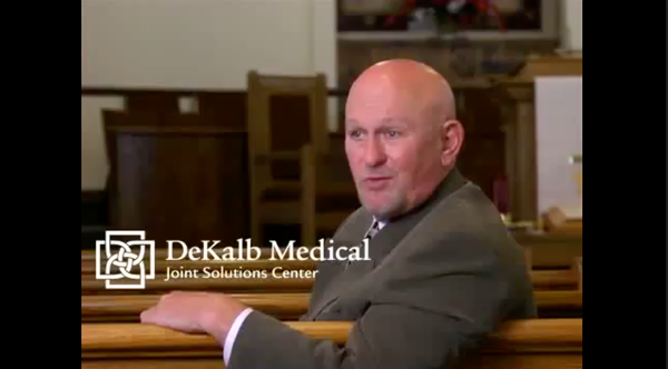 man speaking on camera