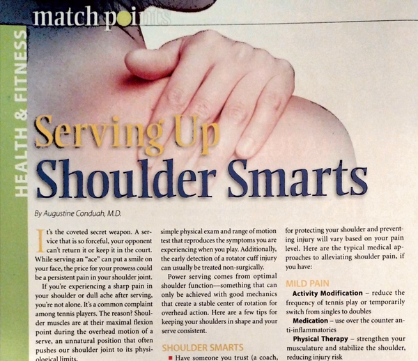 person holding their shoulder in pain