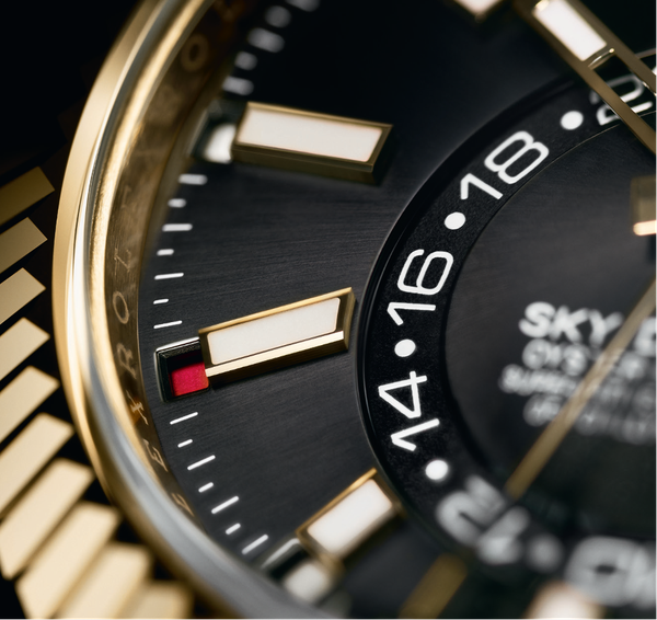 A closeup of the dial of the Rolex Oyster Perpetual Sky-Dweller watch.