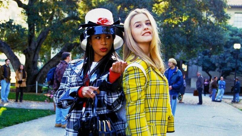 Dionne and Cher pose in their iconic plait suits in a still from Clueless (1995)