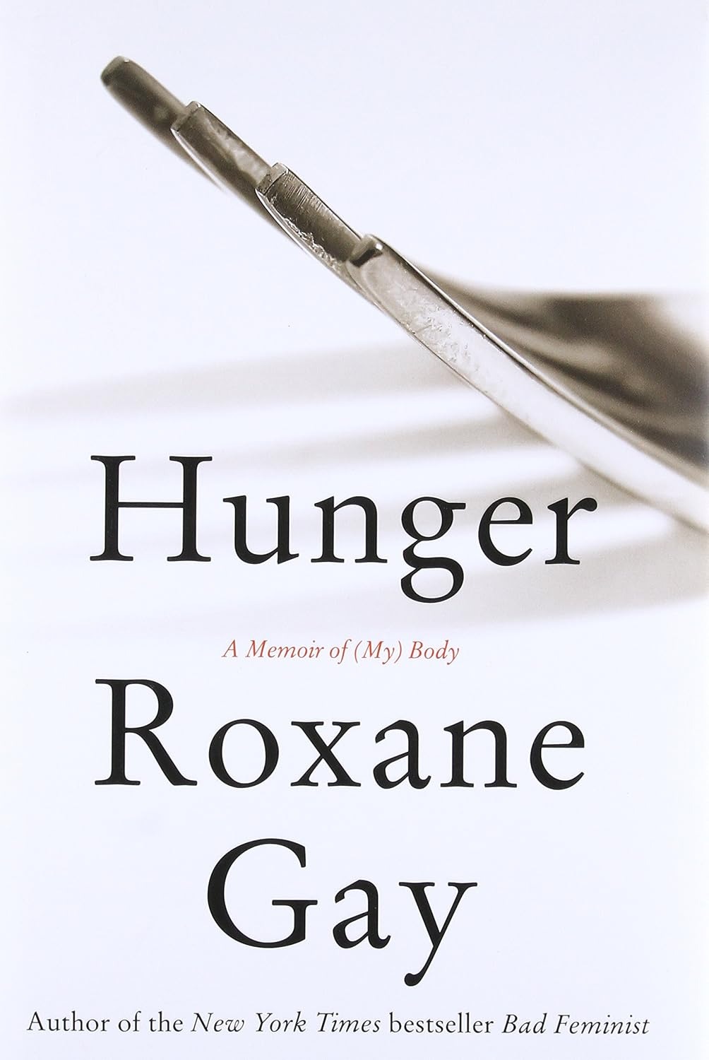 A book cover is seen. Against a white background, the tines of a silver fork are seen, under which, text states: Hunger A Memoir of (My) Body Roxane Gay Author of the New York Times bestseller Bad Feminist