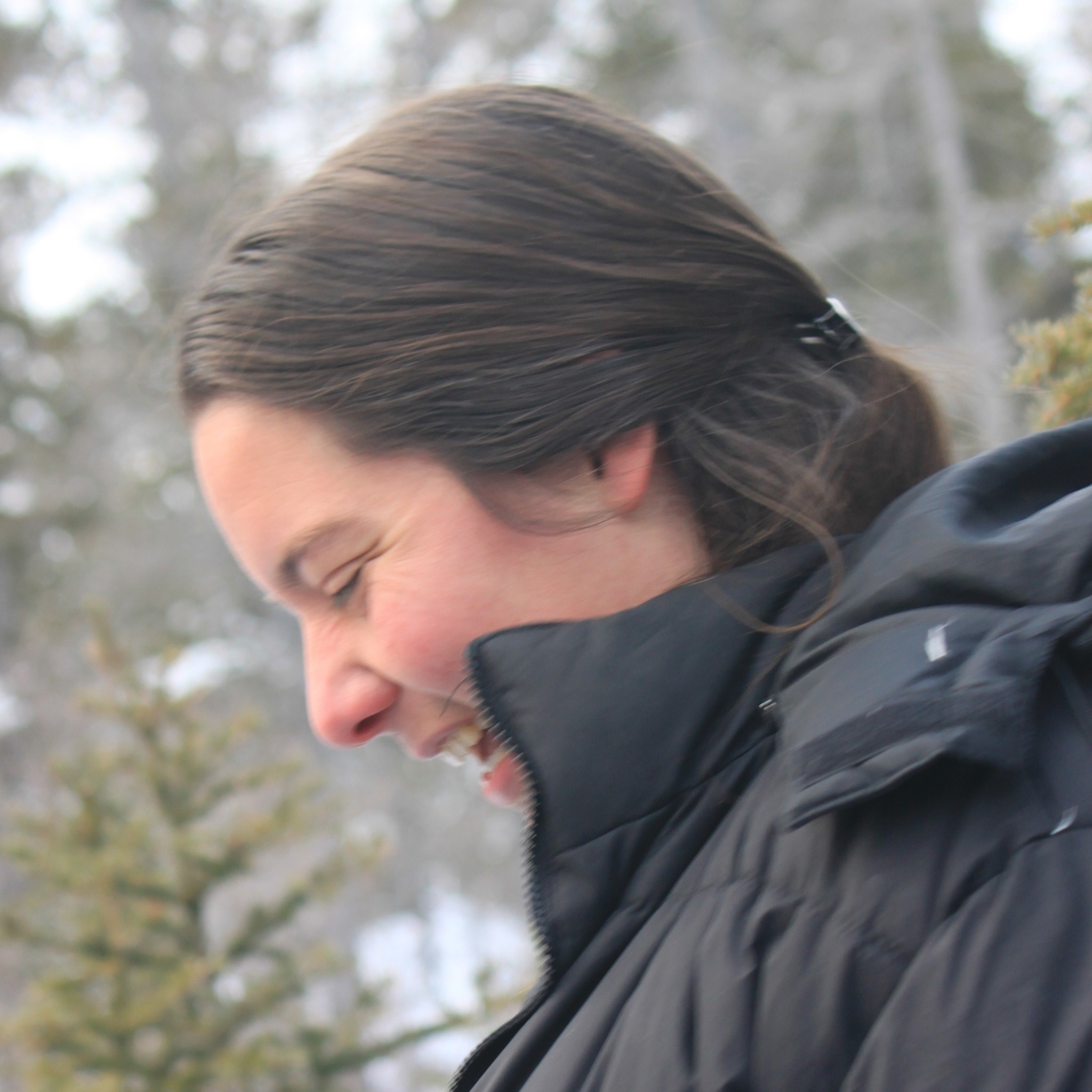 Photo of Shannon in profile in the taiga on Hudson Bay