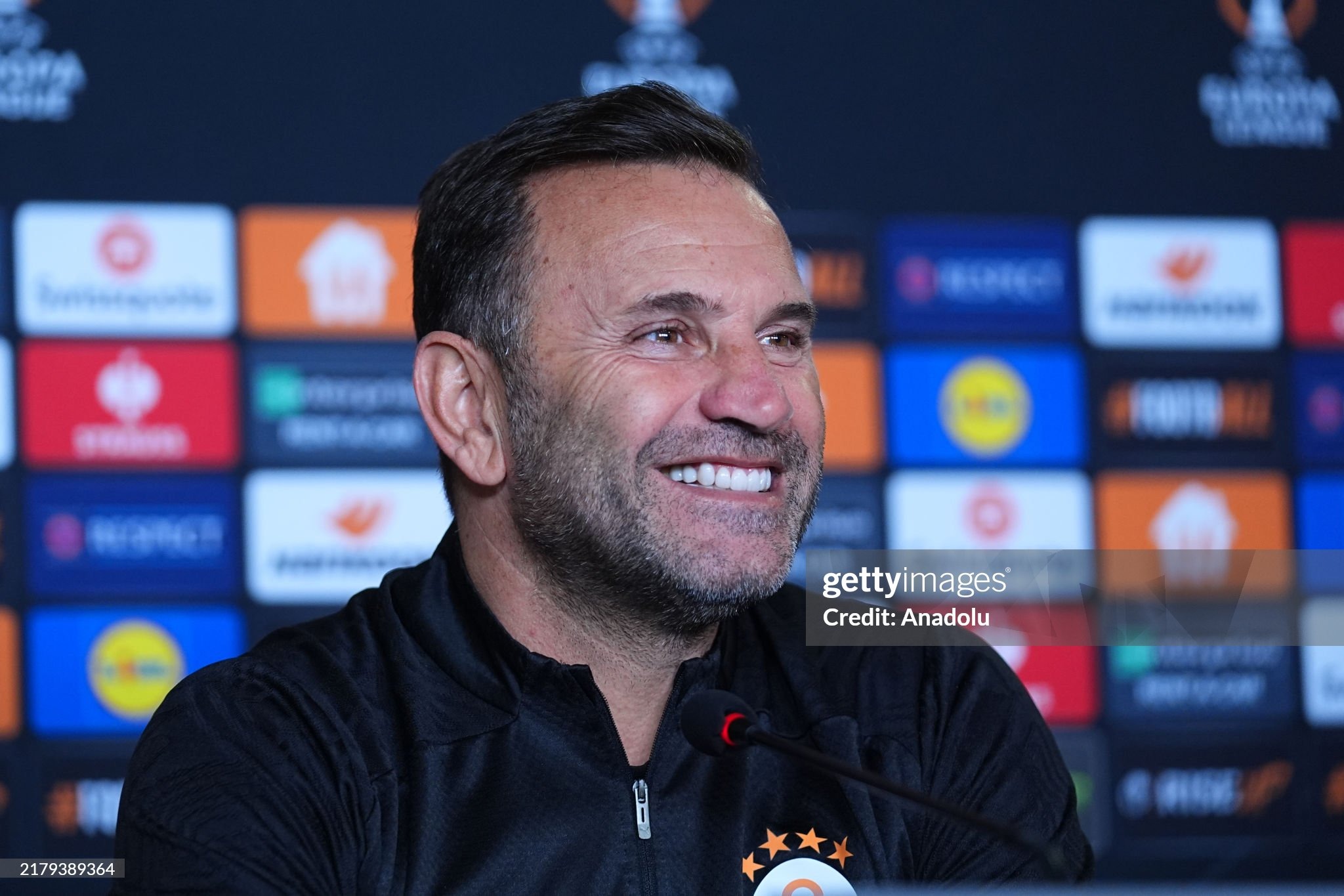 ISTANBUL, TURKIYE - OCTOBER 22: Head coach Okan Buruk of Galatasaray speaks during a press conference ahead of the UEFA Europa League match against Elfsborg of Sweden, at Florya Metin Oktay Training Facilities in Istanbul, Turkiye on October 22, 2024. (Photo by Adem Kutucu/Anadolu via Getty Images)