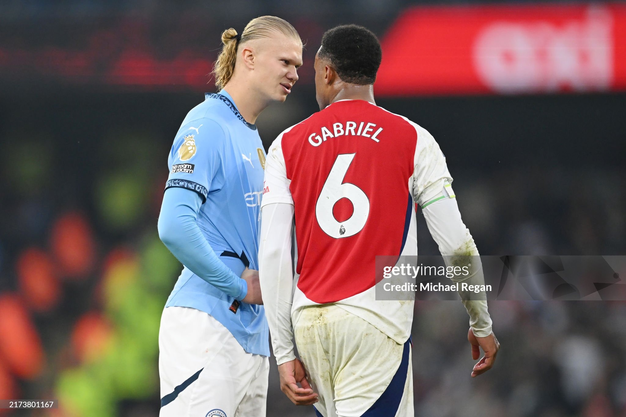 MANCHESTER, ENGLAND - SEPTEMBER 22: Erling Haaland of Manchester City speaks to Gabriel of Arsenal during the Premier League match between Manchester City FC and Arsenal FC at Etihad Stadium on September 22, 2024 in Manchester, England. (Photo by Michael Regan/Getty Images)
