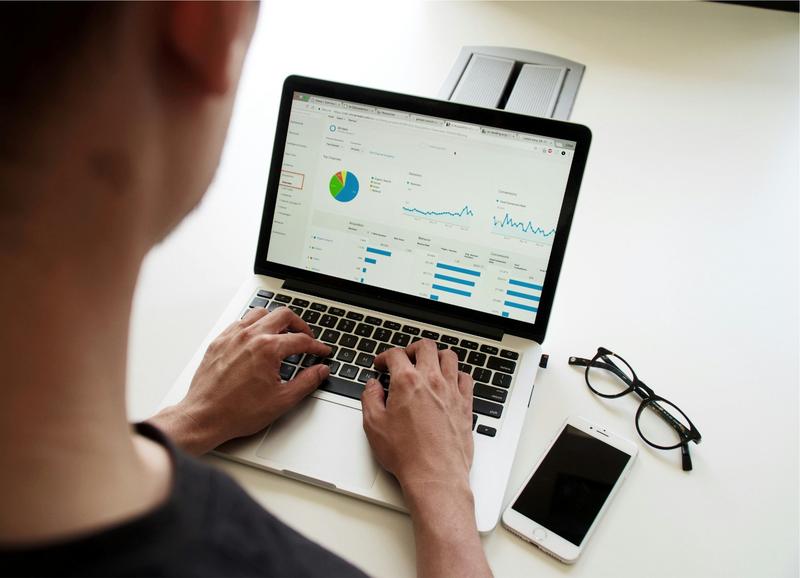 A person typing into a spreadsheet on a laptop. A person typing into a spreadsheet on a laptop.