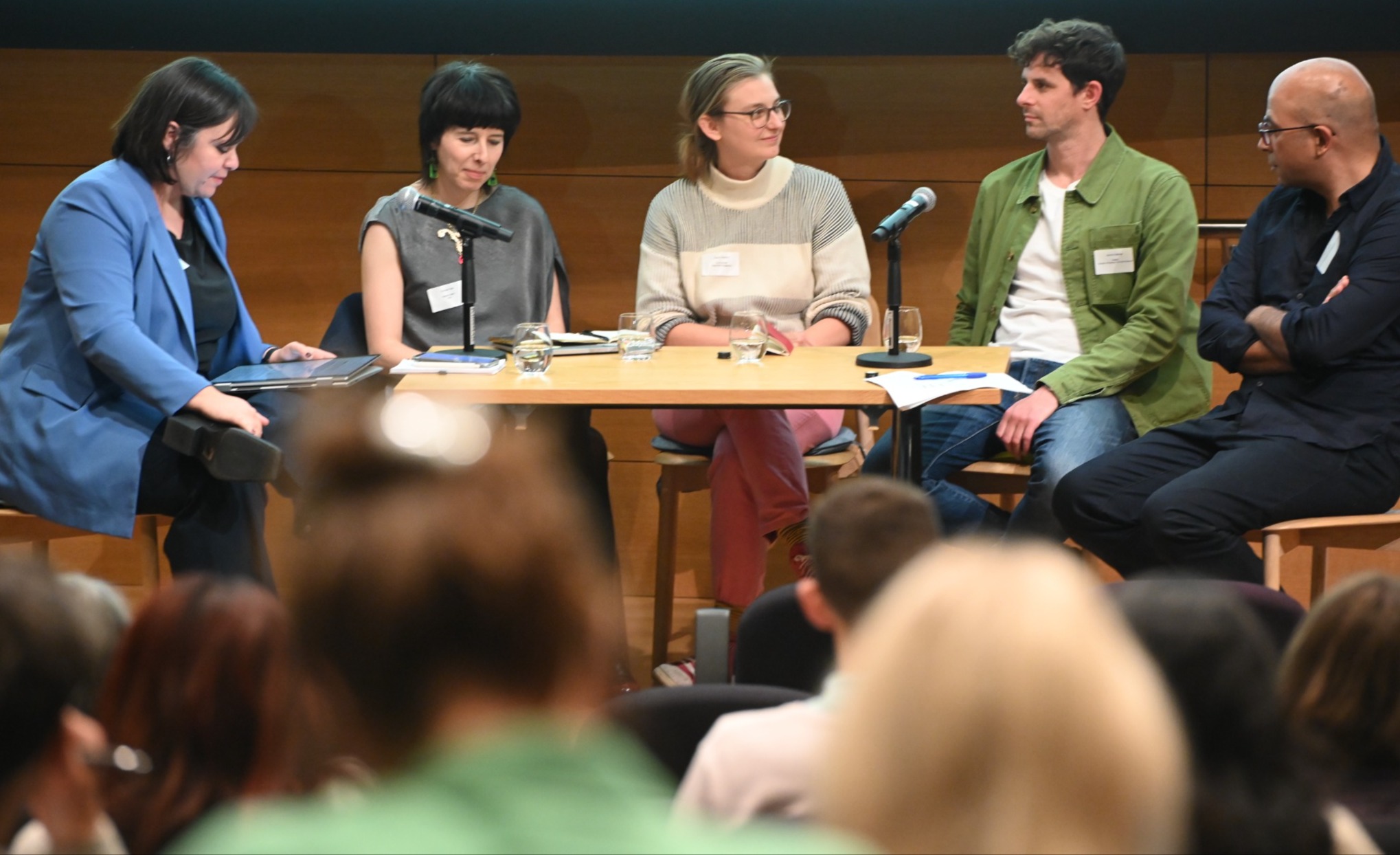 Marianne Guenot sits at a table with four panelists in a conference hall during the Association of British Science Writer's annual UK conference of science journalists 2024.