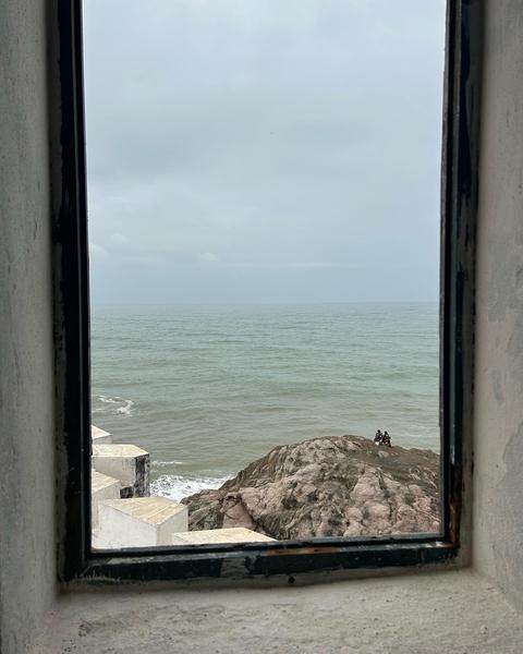 Cape Coast - Two People Sitting on the Beach