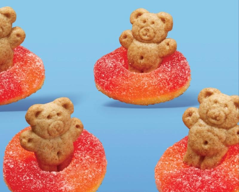 Graham cracker bears in gummy rings that are flotation devices.