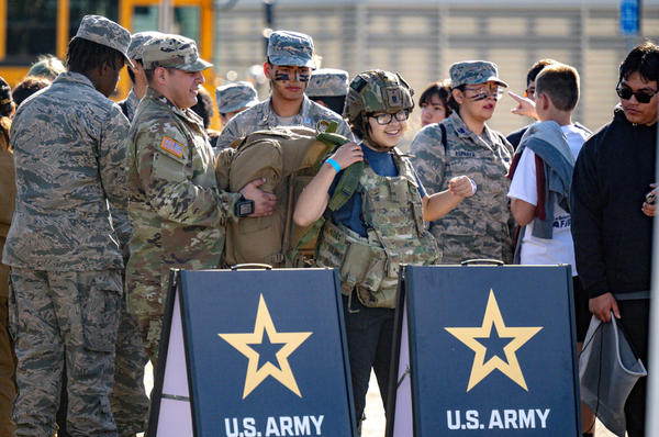 High-schooler Jasmine Florez tries on Army equipment during an event last year in California.