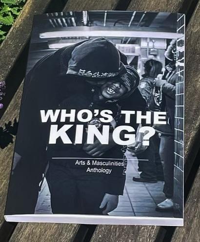 two men hugging in grayscale with large bold letters that read Who's the King?