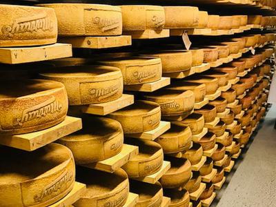 Rounds of cheese aging at Murray's Cheese Caves Rounds of cheese aging at Murray's Cheese Caves