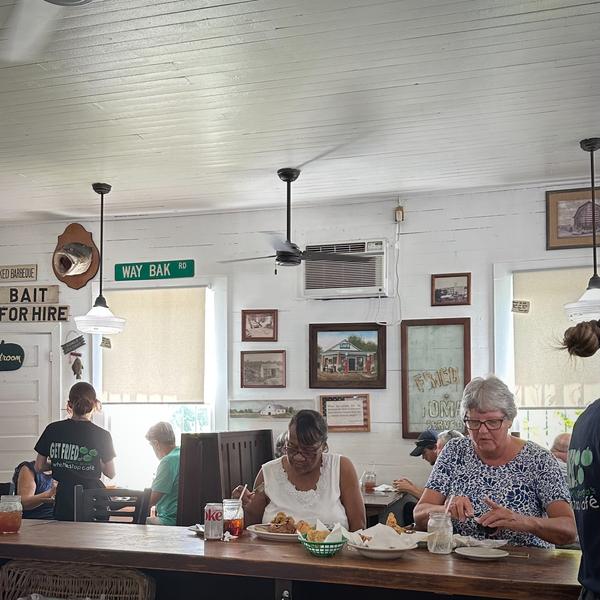 Women eat at the counter of an old American diner