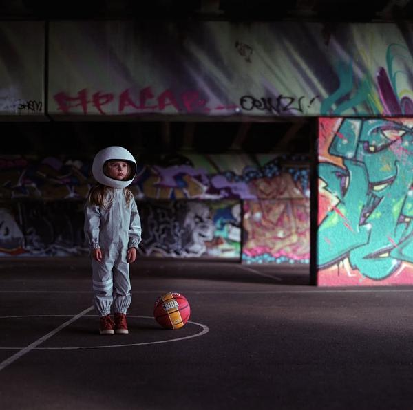 Lonely rocketgirl with a basket ball