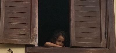 Young girl in window