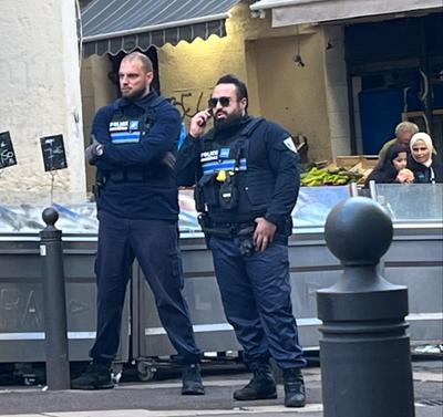 Two French police officers in popular French neighbourhood