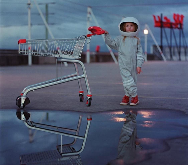 Lonely rocketgirl with shopping cart