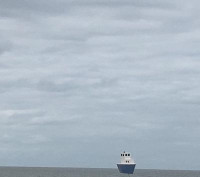 A wooden ship braving the ocean