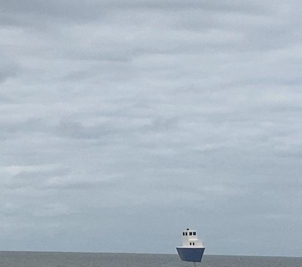 A wooden ship braving the ocean