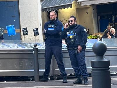 Two French police officers in popular French neighbourhood