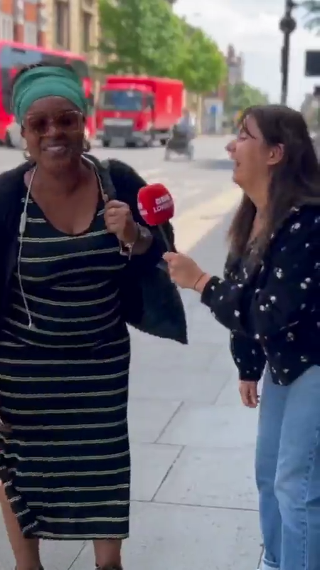 Yasmin Rufo interviewing woman with microphone and laughing Yasmin Rufo interviewing woman with microphone and laughing