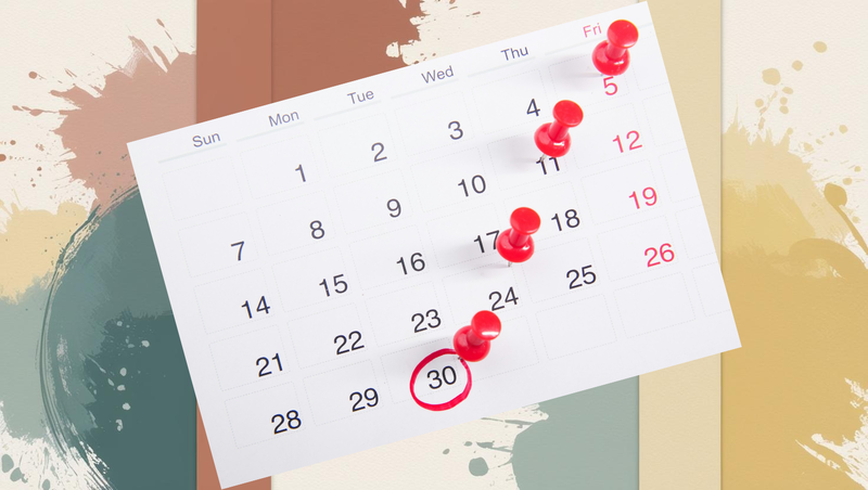 A calendar with red push pins marking important dates, representing the organization and planning that a content calendar brings to business blogging.