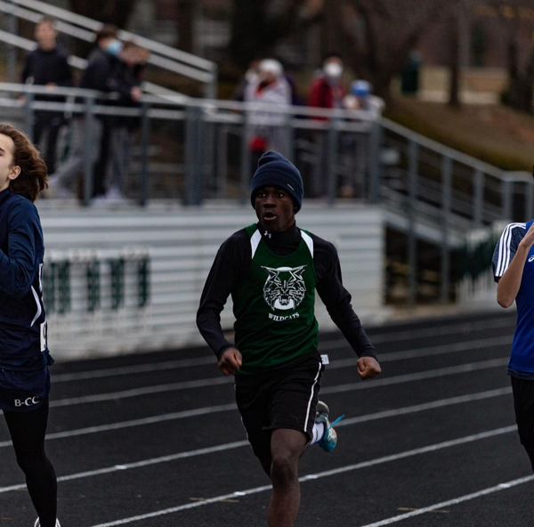 Sophomore Sidney Scale runs the 500 meters against Whitman, Churchill and BCC. Despite the temperatures reaching a high of only the low 40s, the meet was held outside due to the concerns over Covid-19. Such frigid conditions only compound the intensity of the competition.