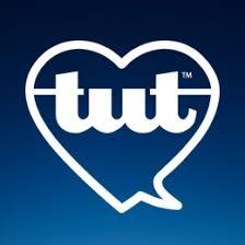 TUT The Universe Talks logo, featuring a teal heart graphic and the text "Thoughts Become Things".