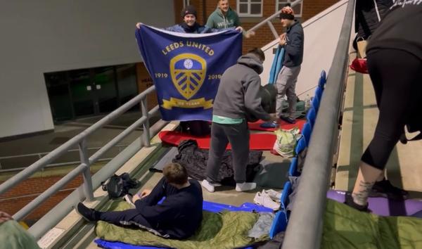 laying out sleeping bags and blankets in the stands of Headingley Stadium preparing to go to sleep