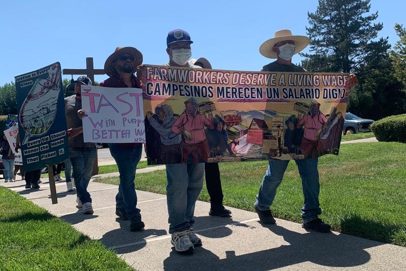 Local farmworkers and their advocates march back to their meeting place of St. Mark’s-in-the-Valley Episcobal Church in Los Olivos.