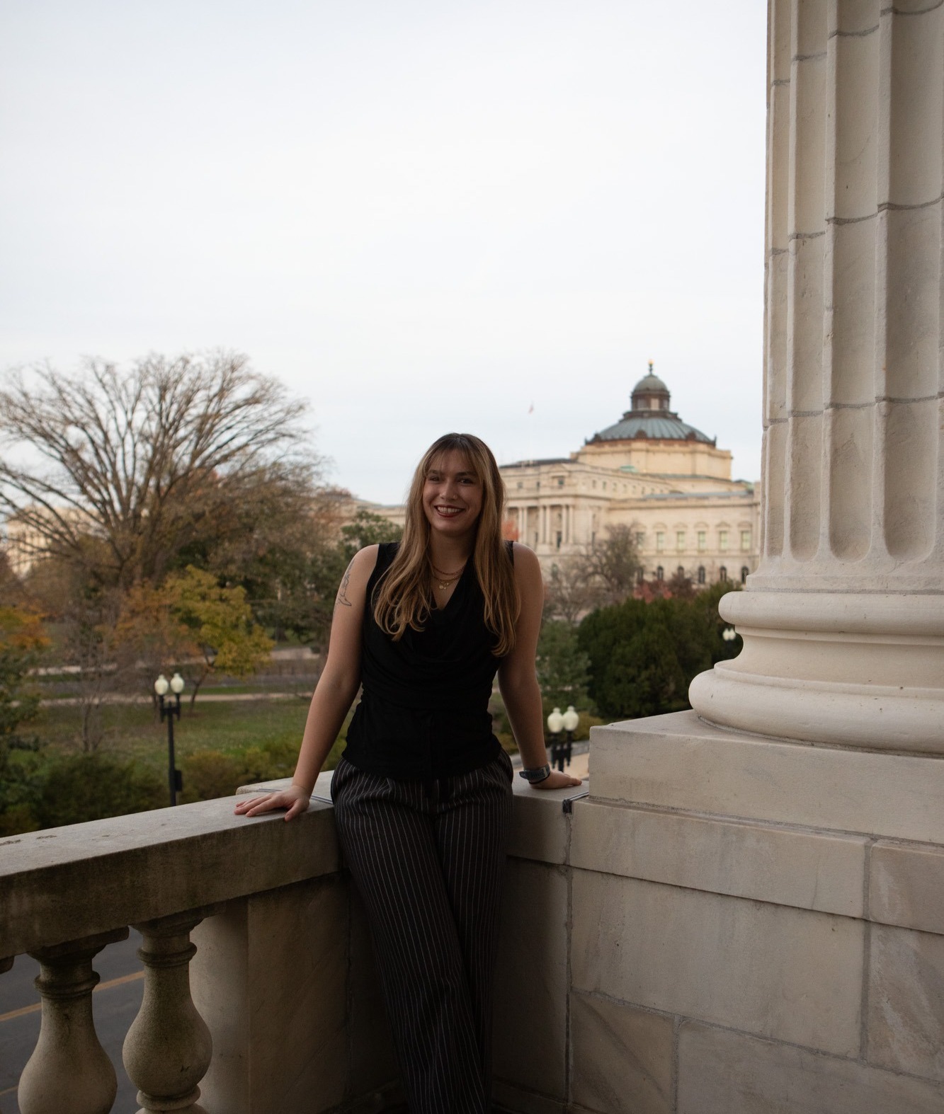 Gabrielle Wallace at the Canon House Office balcony in D.C.