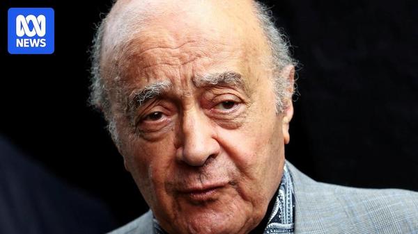 A picture of Mohamed Al Fayed in a grey suit looking away from the camera against a black background