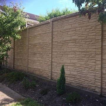A photogtraph of a tan-looking concrete fence.