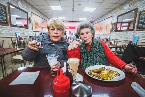 Photograph of two ladies eating breakfast in Sunshine Cafe, Bristol