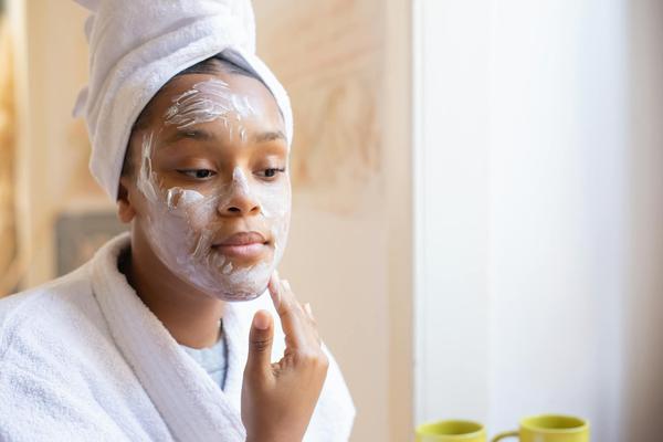a-woman-applying-face-cream a-woman-applying-face-cream