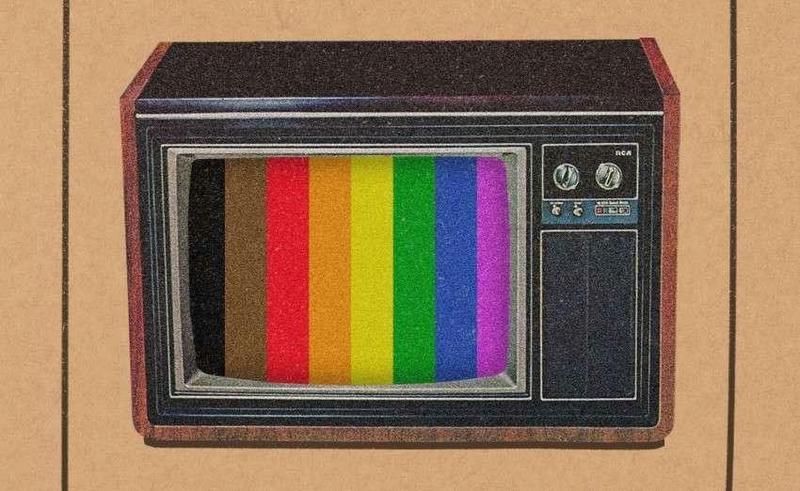 Old television set with rainbow stripes on the screen