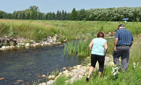 Reeves walk on the border next to flooding