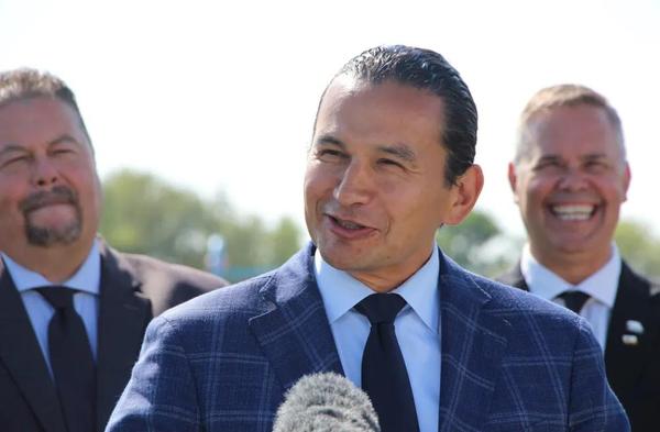 Wab Kinew speaks at a press conference