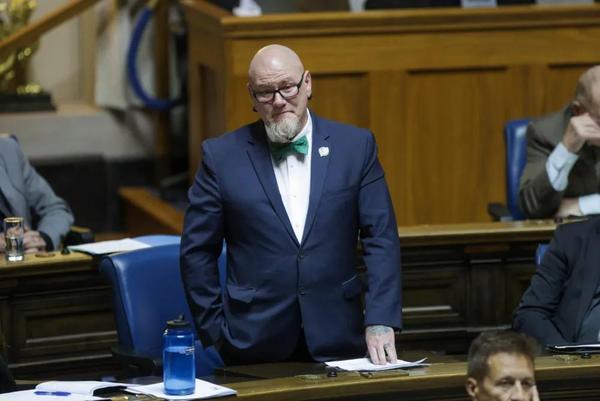 Bob Lagassé stands in the Legislature