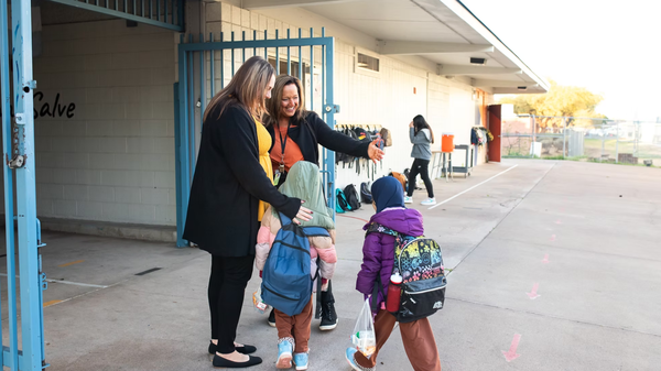 Valencia Newcomer Principal Lynette Wegner welcomes students to the school's gates.